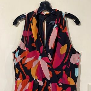 Julio Jordan, size 10, floral/colourful. Skirt: long back and shorter front.